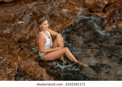 Woman Swimsuit Rock Formation Beach Relaxation - Powered by Shutterstock