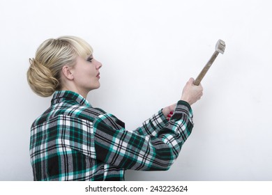 Woman Swings A Hammer