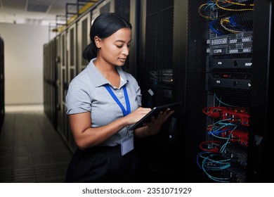 Woman, tablet and data center in inspection, programming and coding of power solution, cables check or cybersecurity. Engineering person on digital tech, hardware and software network in server room - Shutterstock ID 2351071929