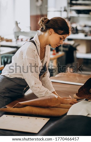 Similar – Caregiver checking blood pressure to a senior woman