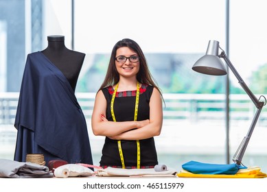 Woman Tailor Working On New Clothing