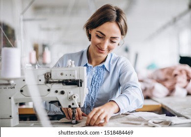 Woman Tailor Working At The Sewing Factory