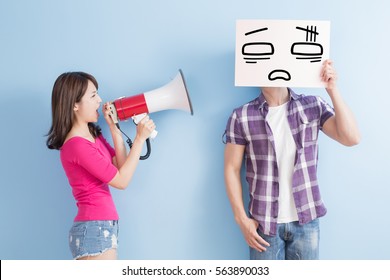 woman take the microphone shout to man take confuse billboard isolated on blue background