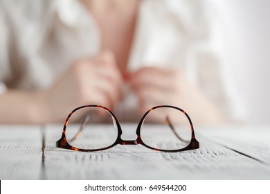 Woman Take Off Her Clothes And Glasses