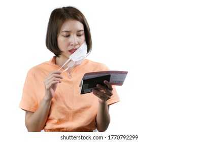 Woman Take Off Her Face Mask Her Holding Passport And Boarding Pass, New Normal Travel Concept.(Fake Barcode)