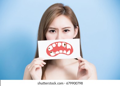 woman take tooth billboard and feel bad on the blue background