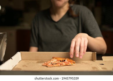 The Woman Takes A Bite Of The Pizza And Puts It In The Box. Overeating And Satiety, Close Up