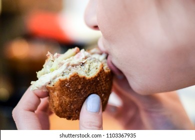 Woman Taking A Bit Out Of A Delicious Panini Sandwich