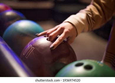 Woman Taking Bowling Ball. Close Up.