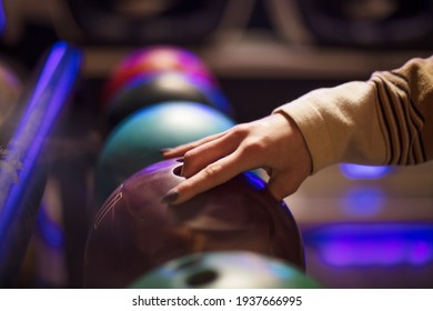 Woman Taking Bowling Ball. Close Up.