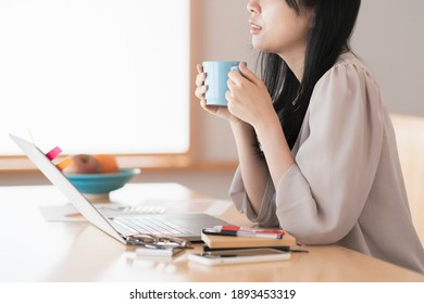 A Woman Taking A Break While Working From Home