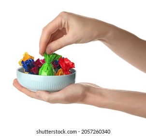 Woman Taking Candy In Green Wrapper From Bowl Isolated On White, Closeup