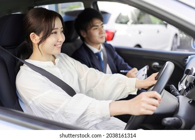 A Woman Taking A Car Driving Lesson