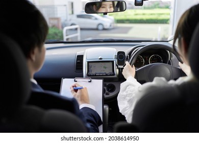 A Woman Taking A Car Driving Lesson