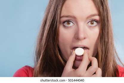 Woman Taking Eating Vitamin C Supplement Pill Tablet. Health Care. Healthy Lifestyle Nutrition Concept.