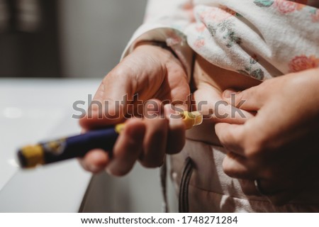 Woman taking fertility injections at home 