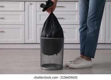 Woman Taking Garbage Bag Out Of Bin At Home, Closeup