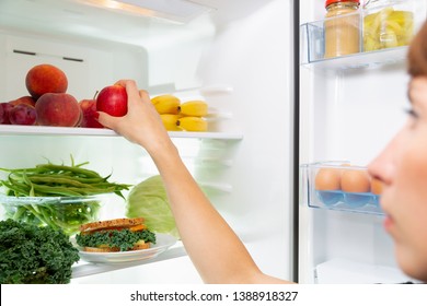 Woman Taking A Healthy Sandwich Out Of The Fridge