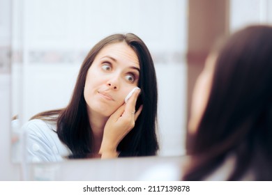 
Woman Taking Her Make-up Of Using A Cotton Wool Ball. Funny Lady Taking Using Tonic Lotion On Her Face As Part Of Her Skin Routine
