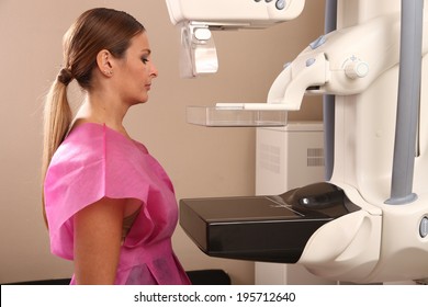 Woman taking a mammogram x-ray test. Mammography machine in a hospital.