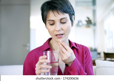 Woman Taking Medication