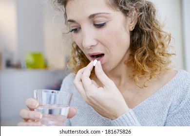 Woman Taking Medication