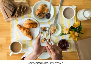 Woman Taking Photo Of Food With Smartphone