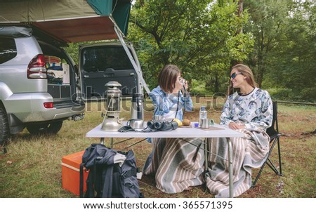 Similar – Image, Stock Photo Young women looking road map with vehicle on background