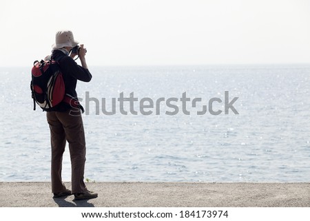 Elderly women enjoying a serene walk by the seaside