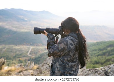 Woman In Taking Photos With A Telephoto Lens