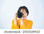 A woman taking a picture with a camera