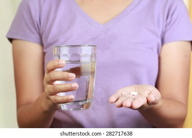  Woman Taking Pills.