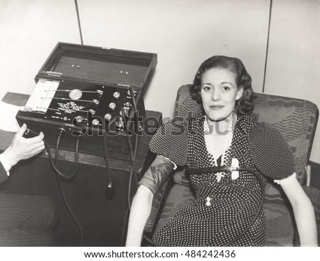 Woman taking a polygraph test