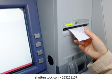 Woman Taking Receipt From An ATM