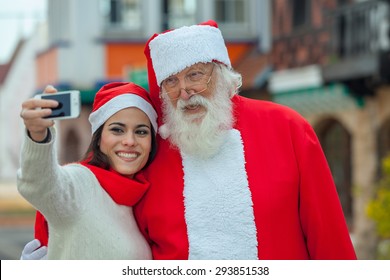 Woman Taking A Selfie With Santa