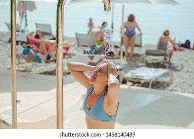 Woman Taking Shower At Sea Beach. Wash Out Salt Water. Summer Vacation