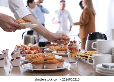 Woman taking snack during coffee break, closeup - Shutterstock ID 2126916215