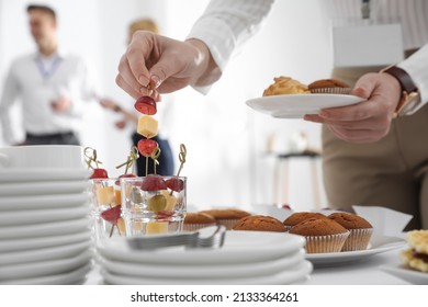 Woman Taking Snack During Coffee Break, Closeup