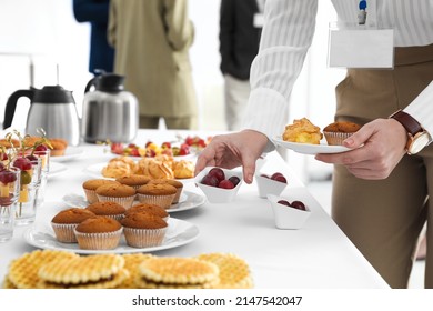 Woman Taking Snack During Coffee Break, Closeup