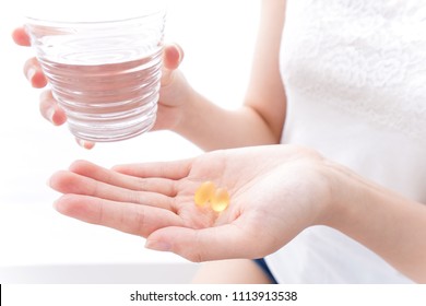 Woman Taking Supplement