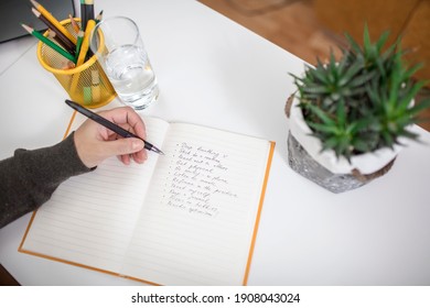 Woman Taking Training Course In Mental Care And Writing Down List Of Rules For Mental Health To Reduce Stress From Distant Job During Lockdown, New Normal Reality, Social Distant Working, Lifestyle