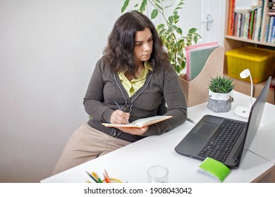 Woman Taking Training Course In Mental Care And Writing Down List Of Rules For Mental Health To Reduce Stress From Distant Job During Lockdown, New Normal Reality, Social Distant Working, Lifestyle