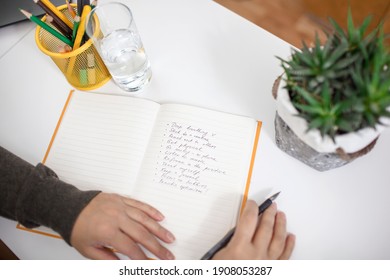 Woman Taking Training Course In Mental Care And Writing Down List Of Rules For Mental Health To Reduce Stress From Distant Job During Lockdown, New Normal Reality, Social Distant Working, Lifestyle