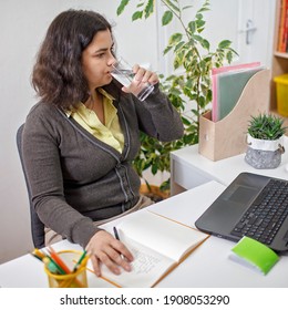 Woman Taking Training Course In Mental Care And Writing Down List Of Rules For Mental Health To Reduce Stress From Distant Job During Lockdown, New Normal Reality, Social Distant Working, Lifestyle