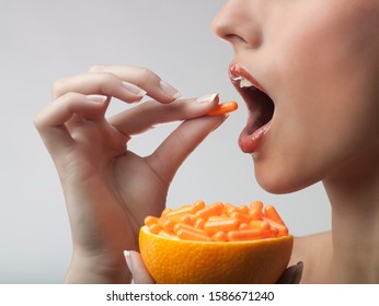 A Woman Taking Vitamin C Tablets