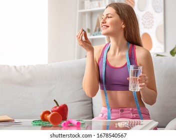 Woman Taking Weight Loss Pills At Home