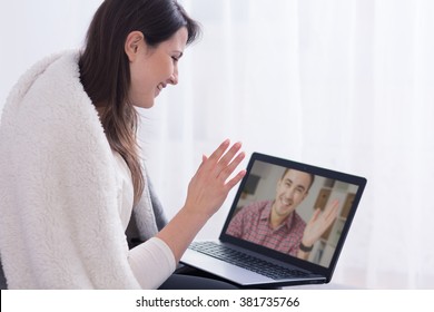 Woman talking with man via skype - Shutterstock ID 381735766