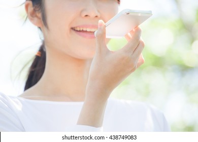 Woman Talking On A Mobile Phone , Voice Recognition , Fresh Green