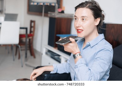 Woman talking on the phone with the digital voice assistant
