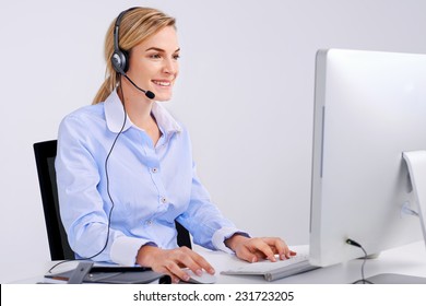 Woman Talking On Phone With Headset And Computer In Office Communication Concept